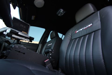 2004 Ford Crown Victoria - Interior view of a 2004 Ford Crown Victoria police car, a laptop and specialized equipment.