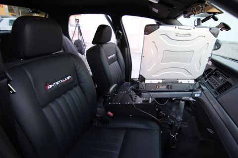 2004 Ford Crown Victoria - 2004 Ford Crown Victoria interior equipped with a Panasonic Toughbook laptop mount and police equipment.