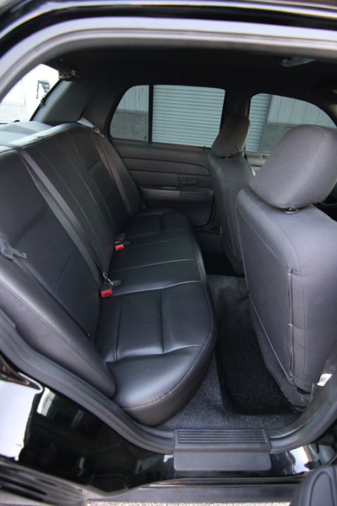2004 Ford Crown Victoria - Interior view of a black car's rear seating area.