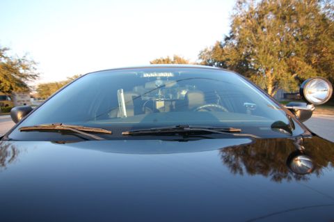 2004 Ford Crown Victoria - Front view of a 2004 Ford Crown Victoria police car interior, including the dashboard and steering wheel.