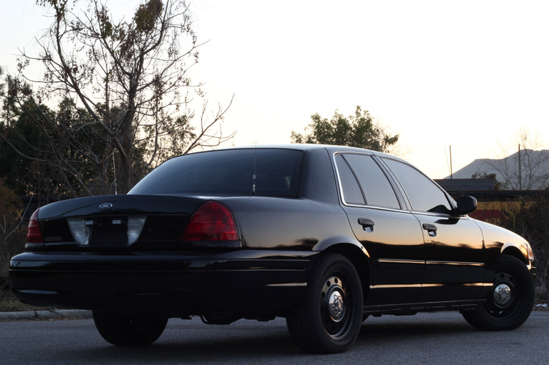 Black 2004 Ford Crown Victoria sedan, rear 3/4 view