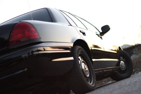 2004 Ford Crown Victoria - Rear quarter view of a black 2004 Ford Crown Victoria sedan.