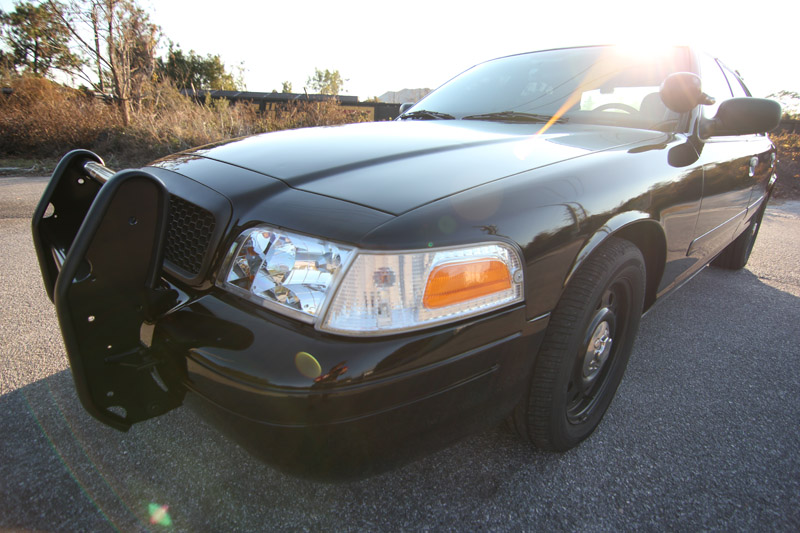 Black 2004 Ford Crown Victoria with push bar, 3q-front view