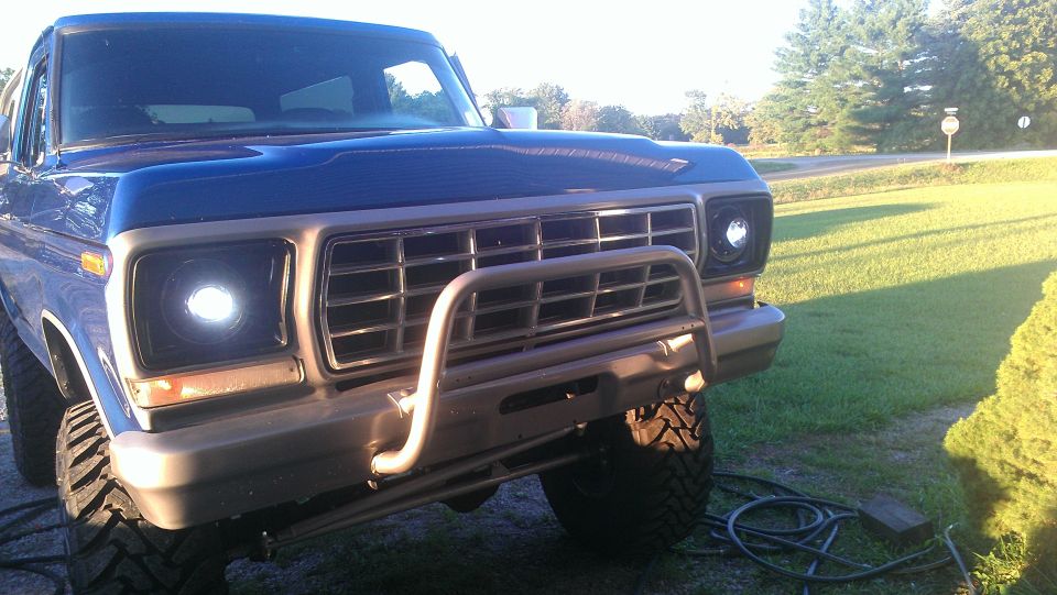 Blue 1978 Ford Bronco front end with a chrome grille and brush guard