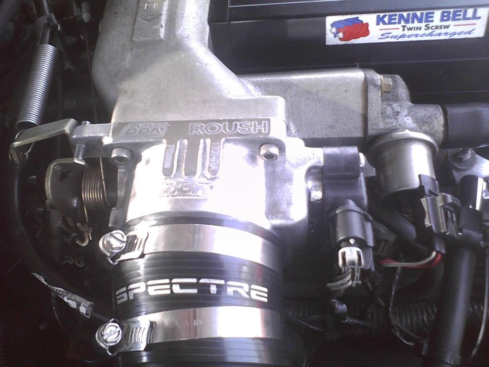 Engine intake manifold with "ROUSH" and "SPECTRE" branding, and a "KENNE BELL Twin Screw Supercharged" sticker