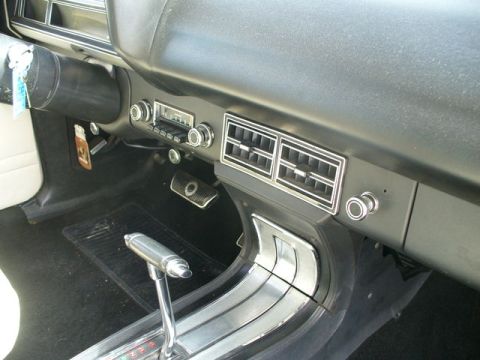 1970 Ford Torino - Interior view of a car's dashboard, the automatic transmission shifter and center console details.