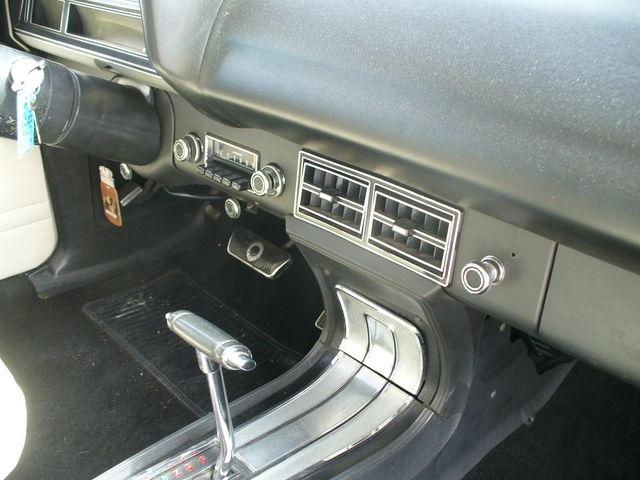 Car interior dashboard with automatic shifter and radio