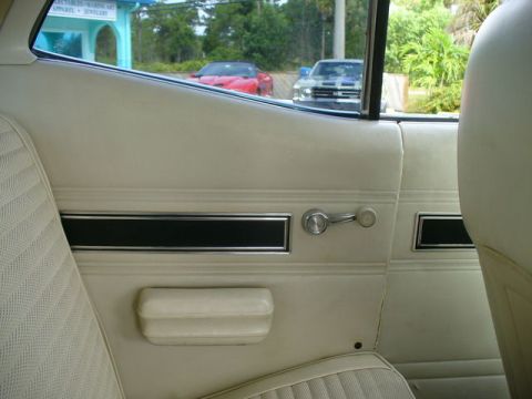 1970 Ford Torino - View from inside a 1970 Ford Torino, looking out at two other vehicles parked outside.