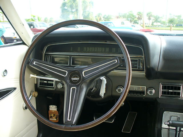 1970 Ford Torino interior with wood-rimmed steering wheel and dashboard