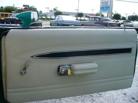 1970 Ford Torino - Interior view of a 1970 Ford Torino door panel, showing the trim and window crank.