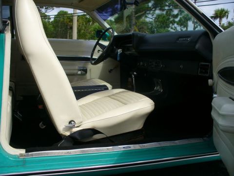 1970 Ford Torino - Interior view of a classic car, showing the front seats, dashboard, and door panel.
