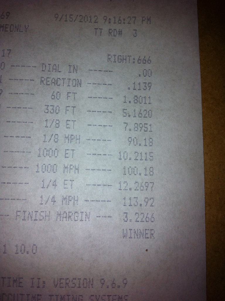 Time slip document with race data including reaction time, 60 ft, 1/8 mile, 1/4 mile, and finish margin