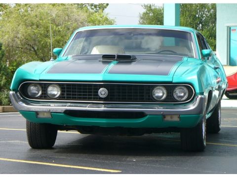 1970 Ford Torino - This 1970 Ford Torino is presented in a striking teal color with a black hood stripe and scoop.