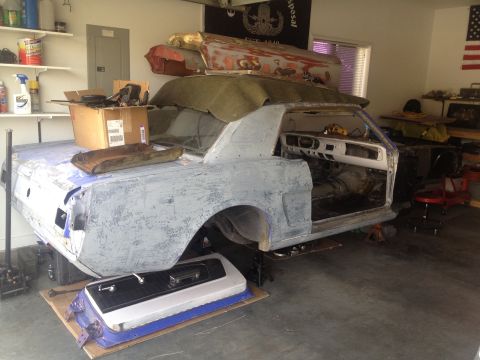 1965 Ford Mustang - This 1965 Ford Mustang is in a garage, likely for restoration work.