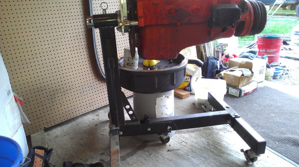 Engine on stand with oil drain pan underneath