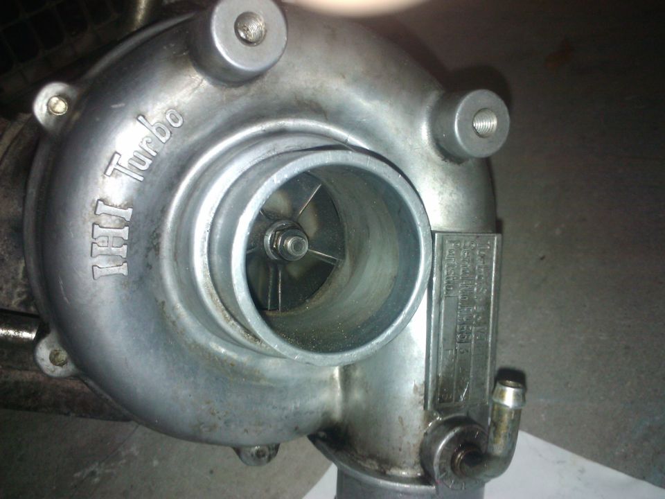 IHI turbocharger with visible impeller blades and a metal data plate