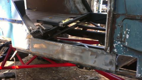 1978 Ford Bronco - Bodywork in progress on a vehicle, with frame and structural components visible.