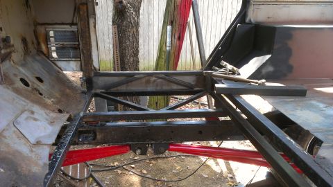 1978 Ford Bronco - Custom roll cage fabrication in progress, showing metal tubing and frame components.