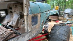 1978 Ford Bronco - This off-road vehicle appears to be undergoing restoration or modification, with significant rust and exposed components.