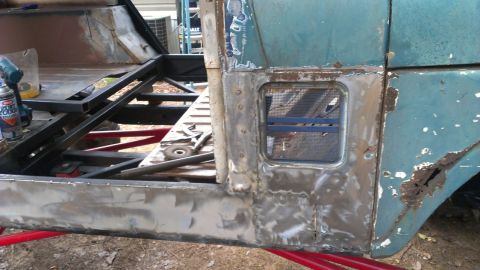 1978 Ford Bronco - This vehicle's body is undergoing significant repair and fabrication, with rust visible on the exterior panels.