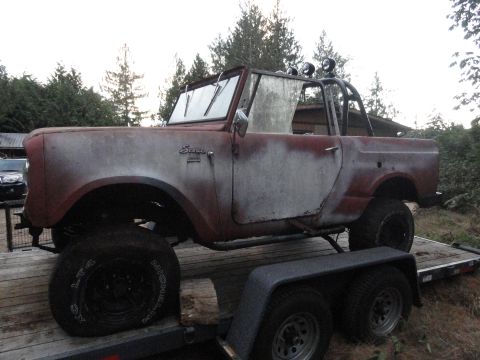 1961 International Scout 80 - This 1961 International Scout is seen on a trailer, displaying significant wear and tear.