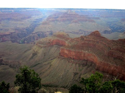 1991 Ford LTD Crown Victoria - View of the Grand Canyon from a scenic overlook, showing vast geological strata.