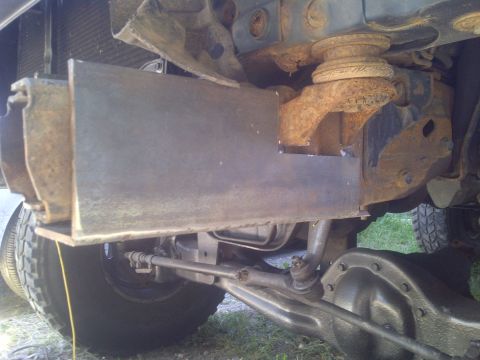 1995 Ford Bronco - Custom metal fabrication is visible on the vehicle's frame, near the front suspension components.