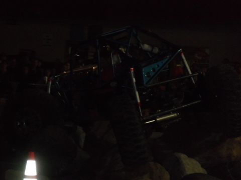 1989 Ford Bronco - Custom buggy with a prominent roll cage and large tires is shown on rocky terrain.