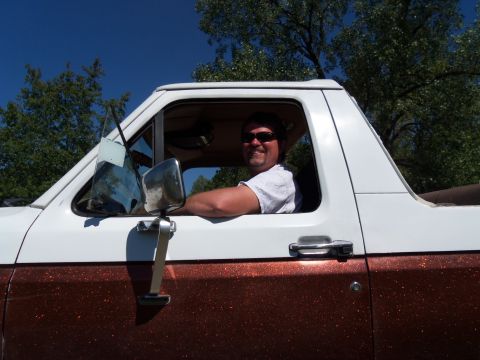 1989 Ford Bronco - Driver smiles from inside a 1989 Ford Bronco with a two-tone paint job.