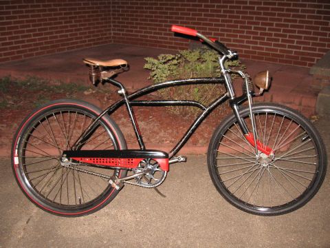 1994 Ford Bronco - Custom cruiser bicycle with a vintage look, a brown leather seat and a front headlight.