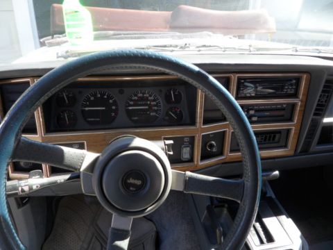 1994 Jeep Cherokee - Interior view of a 1994 Jeep Cherokee, highlighting the dashboard and steering wheel.