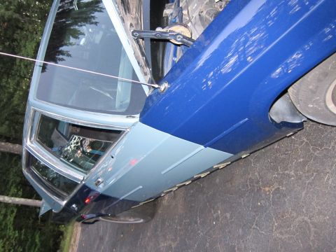 1991 Ford LTD Crown Victoria - The vehicle shows a recent paint job with contrasting blue and light gray panels.