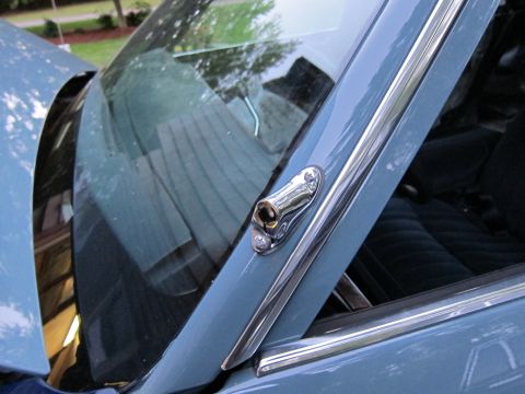 1991 Ford LTD Crown Victoria - Detail of a car's interior, focusing on the A-pillar and windshield trim.