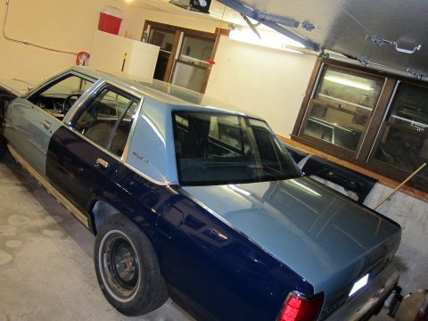 1991 Ford LTD Crown Victoria - This 1991 Ford Crown Victoria LTD is parked in a garage with a two-tone paint scheme.