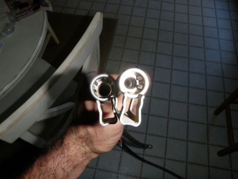 1961 International Scout 800 - Close-up of two fuel line fittings, one appearing newer and shinier than the other.