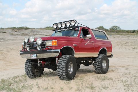 1990 Ford Bronco - This modified Ford Bronco features a lifted suspension and numerous auxiliary lights for off-road use.