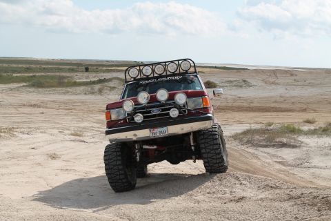 1990 Ford Bronco - This modified 1990 Ford Bronco is equipped with numerous lights and off-road tires for desert terrain.
