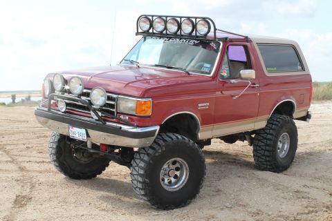 1990 Ford Bronco - This lifted Ford Bronco is ready for off-road adventures with its numerous lights and tires.