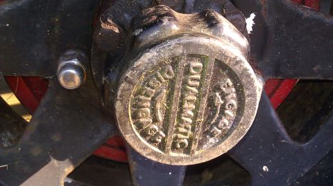 1961 International Scout 80 - A close-up view of a metal hubcap shows the "DUALMATIC" branding with engage and disengage indicators.