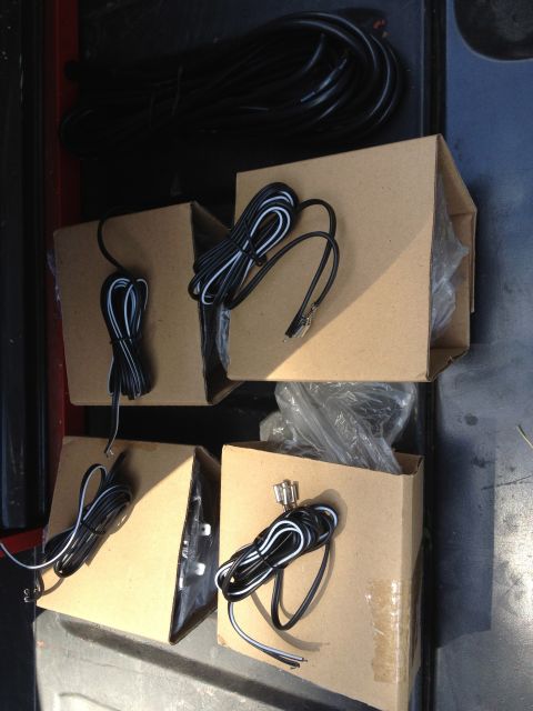 1979 Ford Bronco - Several boxes containing electrical wiring components are neatly arranged, ready for installation or storage.