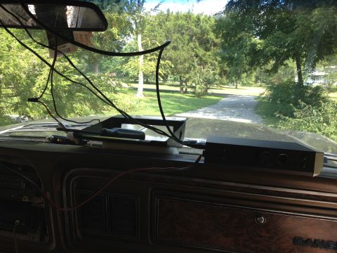 1979 Ford Bronco - Interior view of a 1979 Ford Bronco, showing the dashboard and a view through the windshield.
