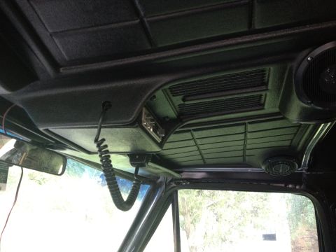 1979 Ford Bronco - Interior view of a 1979 Ford Bronco, showing the overhead console with CB radio and speakers.