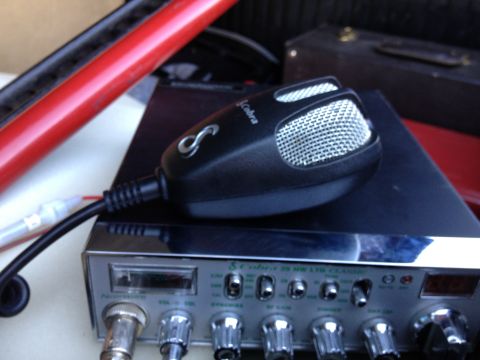 1979 Ford Bronco - Close-up of a Cobra CB radio and microphone, with a red bar visible.