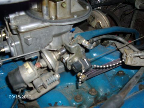 1979 Ford F-150 - Engine components, including a carburetor and associated linkages, are shown in this close-up view.