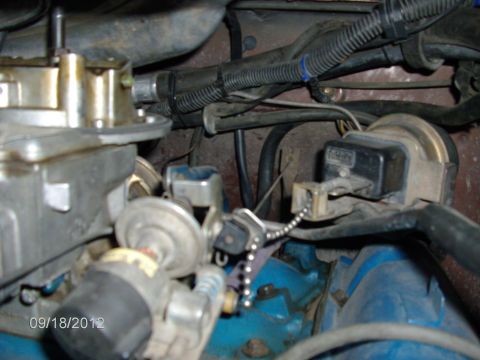1979 Ford F-150 - Engine bay detail with carburetor, wiring, and a set of keys hanging from a chain.