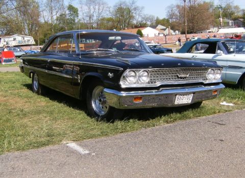 1963 Ford Galaxie - Black 1963 Ford Galaxie coupe parked outdoors with other vehicles visible.