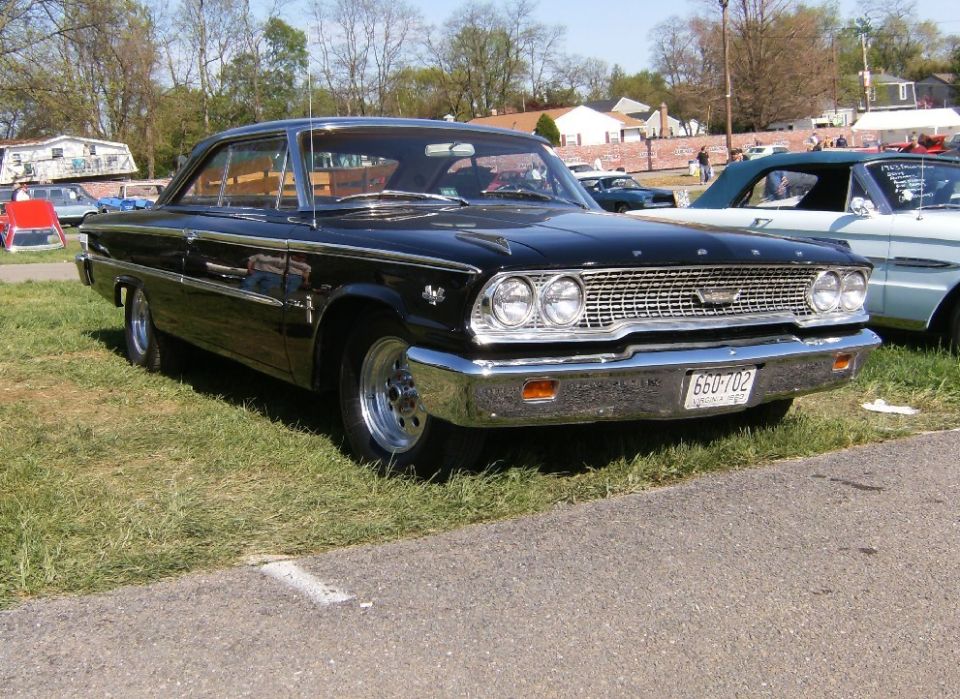 1963 Ford Galaxie coupe, black paint, chrome grille, and front bumper. License plate 660-702