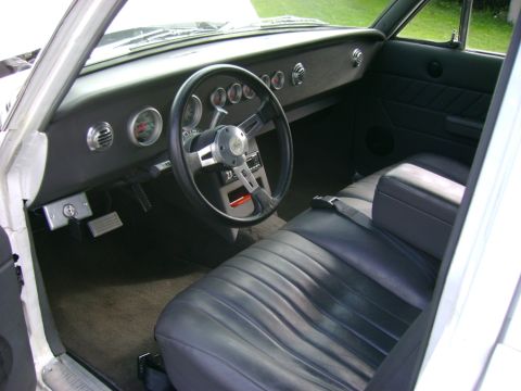 1965 Ford Falcon - Custom leather covered dash and interior. Even the headliner. 90s Grand Prix 60/40 bench Auto Meter Guages