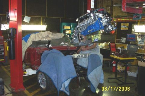 1968 Shelby GT350 - Using a forklift to lower the motor in the car. - $20,000 cherry picker:)