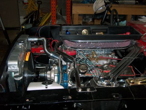 1968 Shelby GT350 - Close-up view of a V8 engine bay, chrome accents and an aftermarket air filter. The Supermotors.net logo is visible at the bottom right.